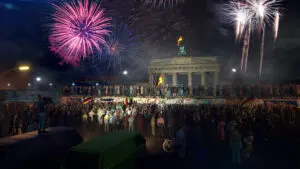 Mitten in der jubelnden Menge befinden sich die Zeitreisenden beim Fall der Berliner Mauer.